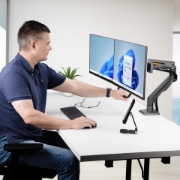 Picture of StarTech.com Desk Mount Dual Monitor Arm with Crossbar, Up To 27" Displays, VESA 75x75/100x100, Max 33lb/15kg, C-Clamp, Fully Articulating, Mechanical Spring, TAA
